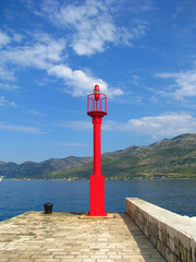 Red lighthouse on the waterfront - Croatia