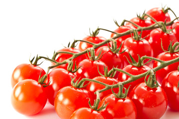 branch of red cherry tomatoes