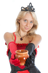 teenager princess girl in crown holds a pot out (focus on face)