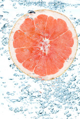 Red grapefruit in water.