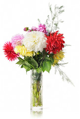 Bouquet of flowers in a crystal vase on white background