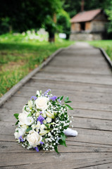 Beautiful wedding flowers bouquet on wooden path