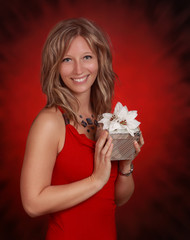 woman holding a silver gift