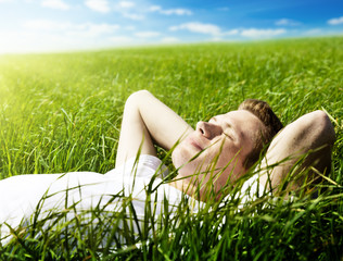 young man in spring grass