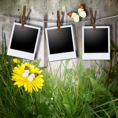 Aged photo frames with rope on wood background