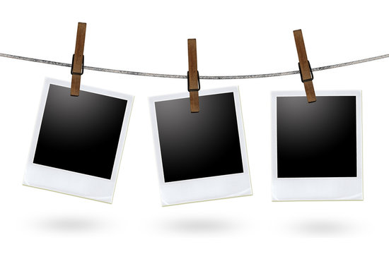 blank photo frames on a clothesline