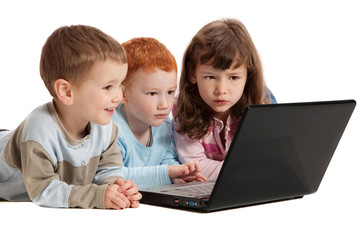 Happy children learning on kids notebook computer