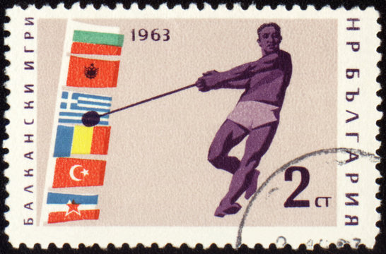 Athlete with hammer on post stamp
