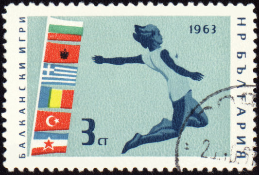 Jumping athlete on post stamp