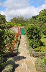 An English Walled Garden with Path bordered with lavender