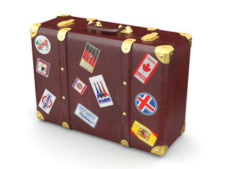 Brown leather suitcase with travel stickers