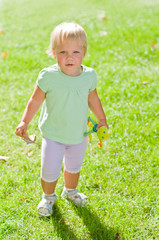 Little girl on a grass