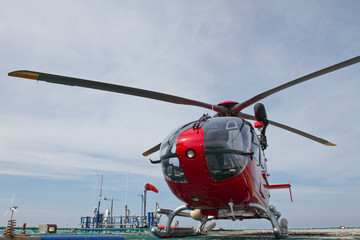 Helicopter standing on offshore platform