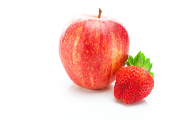big juicy red ripe strawberries and apple isolated on white