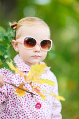 Cute girl in autumn park