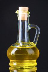 olive oil in jar on black background