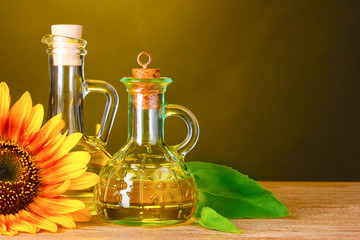 sunflower oil and sunflower on yellow background