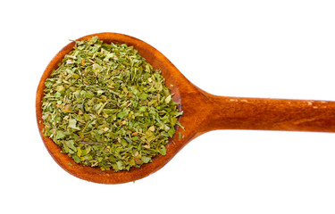 spices in the spoons isolated on white