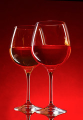 wine glasses on red background
