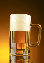 mug of beer on a yellow background