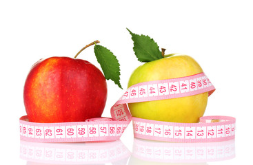 two apples and measuring tape isolated on white