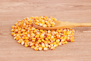 corn and spoon  on brown