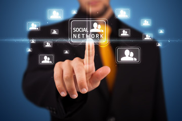 Businessman pressing modern social type of icons