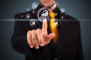 Businessman pressing modern business type of buttons