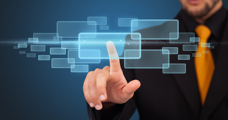 Businessman pressing high tech type of modern buttons