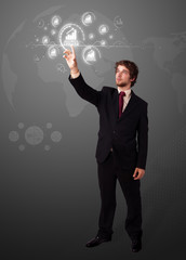 Businessman pressing modern business type of buttons