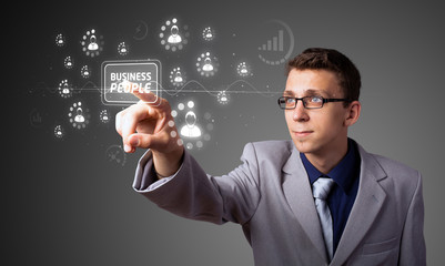 Businessman pressing modern business type of buttons