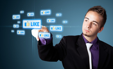 Businessman pressing modern social type of icons