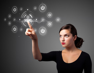 Businesswoman pressing simple type of start buttons
