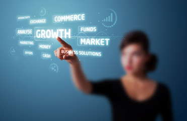 Businesswoman pressing modern business type of buttons