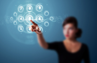 Businesswoman pressing high tech type of modern buttons