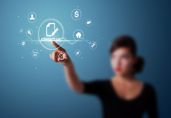 Businesswoman pressing virtual messaging type of icons
