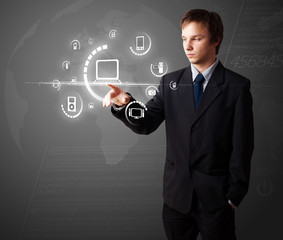 Businessman pressing virtual media type of buttons