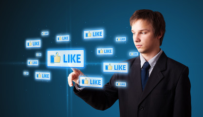 Businessman pressing modern social type of icons
