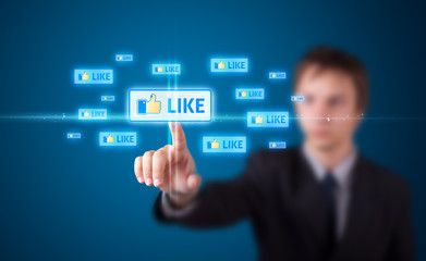 Businessman pressing modern social type of icons