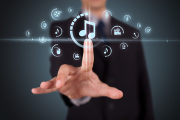 Businessman pressing virtual media type of buttons