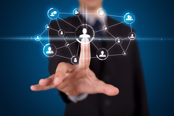 Businessman pressing modern social type of icons