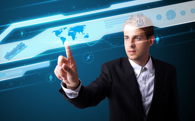 Businessman pressing high tech type of modern buttons