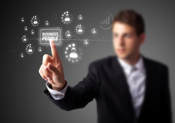 Businessman pressing modern business type of buttons