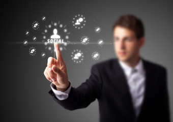 Businessman pressing modern social type of icons