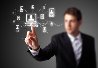 Businessman pressing modern social type of icons