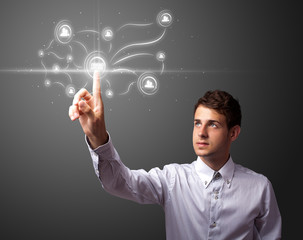 Businessman pressing modern social type of icons