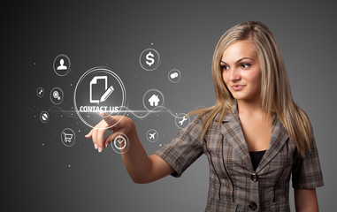 Businesswoman pressing virtual messaging type of icons