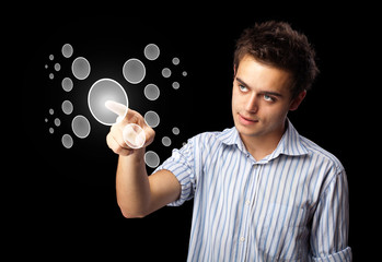 Businessman pressing high tech type of modern buttons