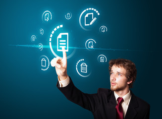 Businessman pressing modern business type of buttons