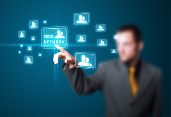 Businessman pressing modern social type of icons
